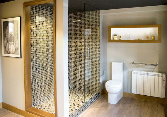 Bathroom with shower, glass screen, white with natural wood.